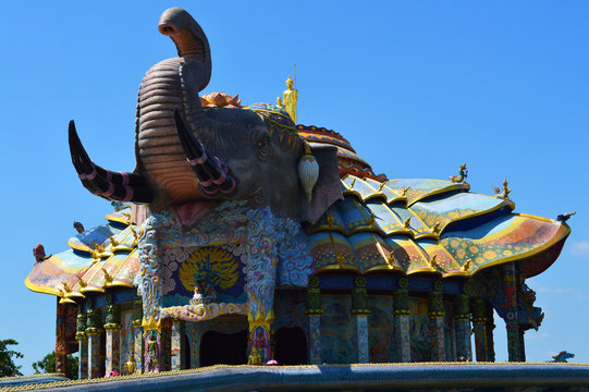 Buddha image standing on an elephant-shape church
