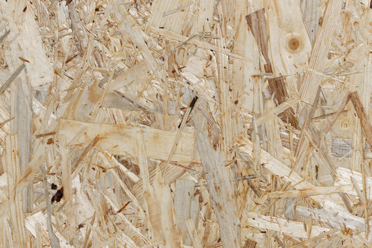 Abfallholz-Recycling: Ausschnitt einer Grobspanplatte als Hintergrund