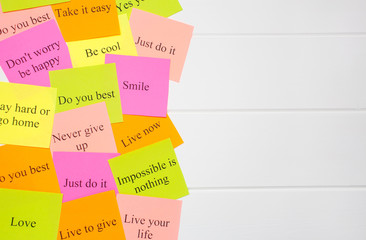 Motivational words on colorful stickers on white background. A vision Board. Copy space. Cards with...