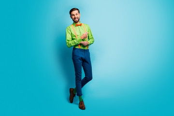 Fototapeta na wymiar Full length body size view of his he nice attractive cheerful cheery brunette guy wearing cool funky look isolated over bright vivid shine vibrant blue green teal turquoise color background