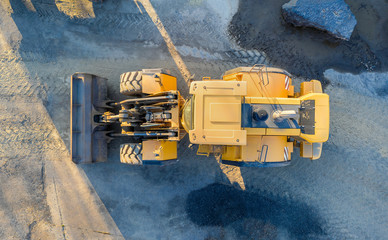excavator on an construction site from above