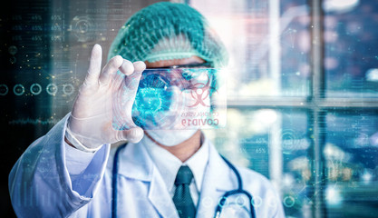 Doctor holding transparent tablet with futuristic hud screen tablet. Covid-19, Bacteria, virus, microbe. Medical concept of the future. 