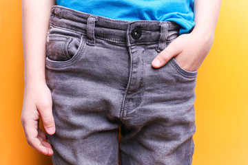 Boy in gray jeans