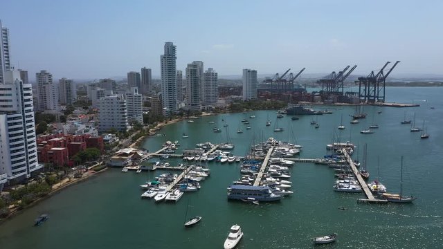 Aerial view of a cargo port in Cartagena, Colombia. Beautiful view of the bay with yachts and modern buildings.