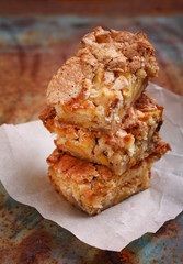 Charlotte apple pie sliced, decorated with powdered sugar