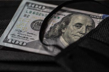 medical masks and money. crisis 2020, coronavirus concept. Dollars and a protective mask. illustration of expensive mask prices. Covid - 19 .