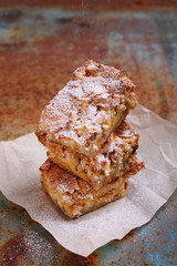 Charlotte apple pie sliced, decorated with powdered sugar