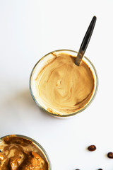 Cold coffee – latte, cappuccino or dalgona. Summer trendy drink with whipped milk, top view