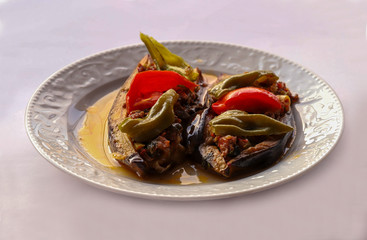 Cauliflower - baked vegetables with eggplant, ground meat and tomato sauce in the oven, Turkish cuisine, horizontal view from above, close-up