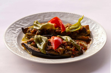 Cauliflower - baked vegetables with eggplant, ground meat and tomato sauce in the oven, Turkish cuisine, horizontal view from above, close-up