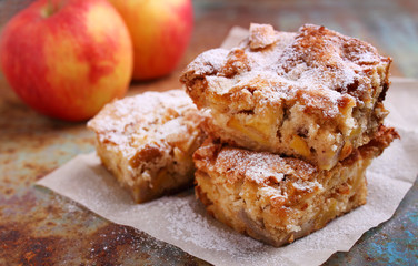Charlotte apple pie sliced, decorated with powdered sugar
