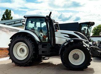 Fototapeta premium tractor with big wheels, machine for agricultural work and transportation of goods