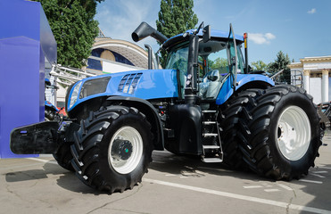 Obraz premium tractor with big wheels, machine for agricultural work and transportation of goods