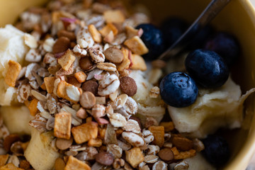Breakfast bowl. Yogurt, cereals, berries and banana