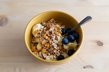 Breakfast bowl. Yogurt, cereals, berries and banana