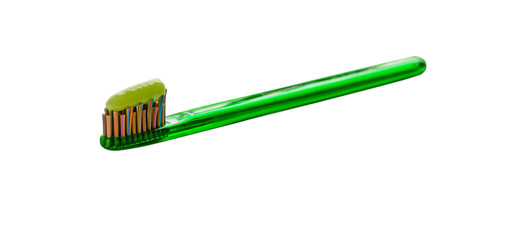 green toothbrush with healing herbs toothpaste isolated on white