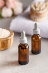 Brown dropper bottles on a blurry background. Beauty concept. Natural oils. Spa items.