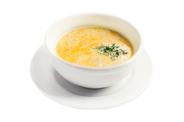 Cream soup with dill on white background