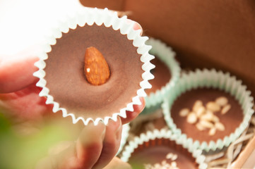 Candy chocolate dessert sweet food. Assorted Chocolate pralines on brown background.