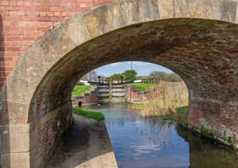 Fototapeta na wymiar Canal Lock Gates and Bridge