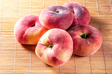 Peaches-donuts on a bamboo napkin