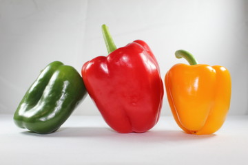 three peppers isolated on white background