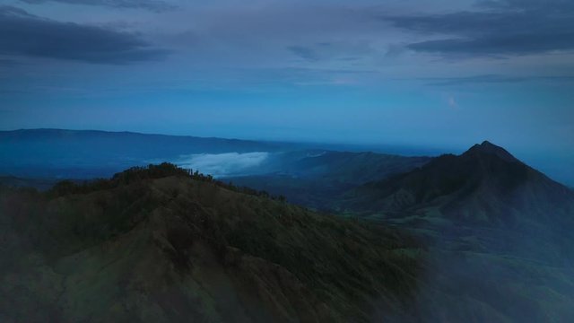 Aerial view of foggy mountains at early morning near Kawah Ijen Volcano. Indonesia, Java.