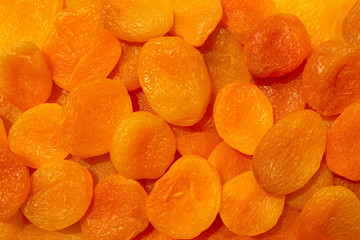 Background made of dry apricots,top view. Dried fresh juicy apricots backdrop.