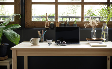 Modern home office creative space perfect for working from home lifestyle with laptop on the desk...