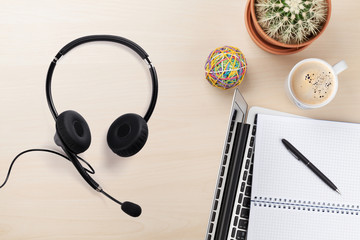 Office wooden backdrop with supplies and headset