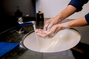 Washing hands rubbing with soap man for covid-19 virus prevention, hygiene to stop spreading covid-19virus.