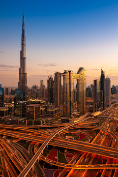 The view of Dubai skyline with Burj Khalifa and Sheikh Zayed road at dusk, UAE