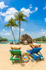  couple sitting and relaxing tropical the beach