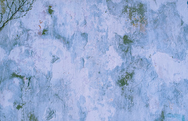 Blue background. Wall covered with old cracked stucco, tinted in classic blue. Bright neon backdrop. Modern urban industrial concept. Copy space. Selective focus image.