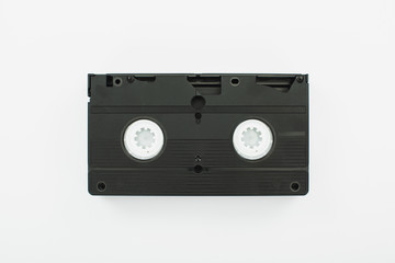top view of black VHS cassette on white background