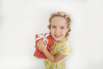 Cute little girl dressed in spring or summer smiling at camera on isolated light background