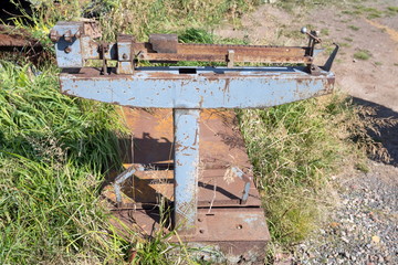 Fototapeta na wymiar Old Soviet mechanical freight scales stand on the grass in summer.