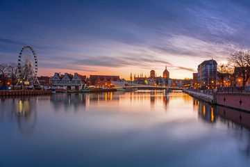 Fototapeta na wymiar Gdansk with beautiful old town over Motlawa river at sunset, Poland.