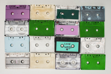 Fototapeta premium top view of colorful recording cassettes on white background