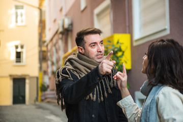 Fototapeta premium Angry couple yell to each other outside