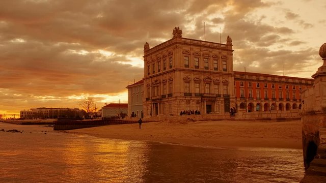 Incredible sunset over Commerce Square,  the Tagus and the Ponte 25 de Abril suspension bridge in Lisbon, Portugal