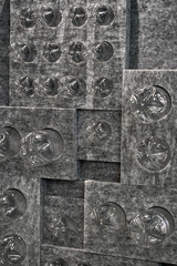 Gray installation with many inserted plastic bottles