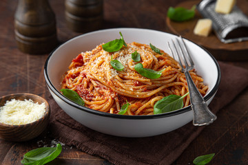 spaghetti pasta with tomato sauce  in white bowl