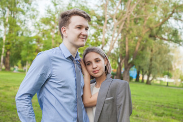  Romantic vacation. Young woman and man in park