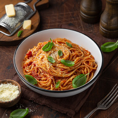 spaghetti pasta with tomato sauce  in white bowl