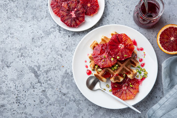sweet waffles with red blood oranges and pistachios nuts