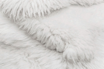 White fluffy fur texture, light soft wool background