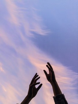 Silhouette Of Hands Against The Sky