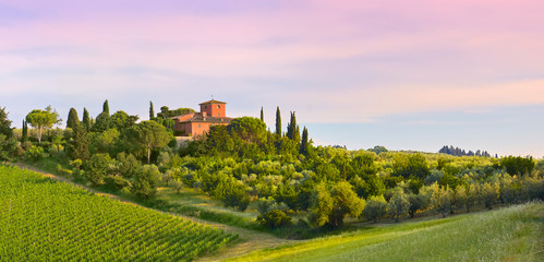 Sunset panorama with farm, from Tuscany, in the Chianti region. Italy.