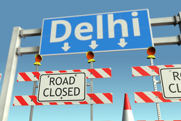 Traffic barricades near Delhi city traffic sign. Coronavirus disease quarantine or lockdown in India conceptual 3D rendering